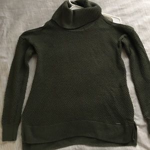 Knitted olive green turtle neck sweater